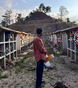 A community leader from Azacualpa looks at the relocated ancestral cemetery that the mining company Aura Minerals destroyed. Photo credit: Minnesota Center for Environmental Advocacy