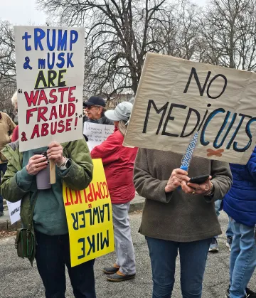 Protesters holding signs