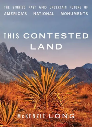 a plant in a desert landscape with mountains in the backgorund