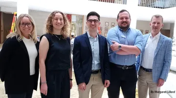 Five members of the NC Sierra Club's lobby day team pose in a Legislative Building atrium