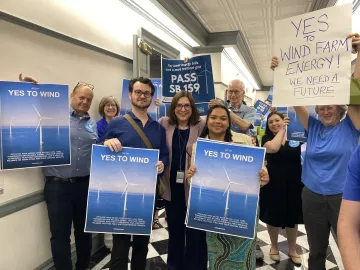 picture of sierra club advocates with Rep. Claire Snyder Hall on June 30th 2025 with Yes on Wind signs
