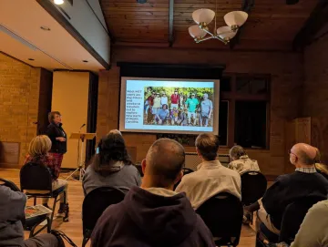 foothills members watching slide show about mountain to sea trail