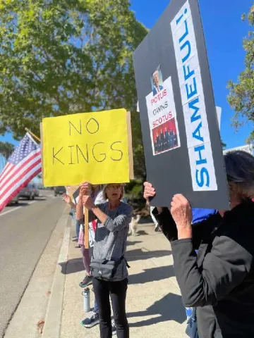 Protesters line the streets of Grover Beach at No Kings rally on October 18