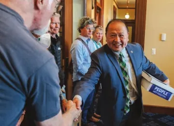 Senator Hawj greets community members on the Earth Day delivery of People Not Polluters petitions. Photo credit: Devon Young Cupery