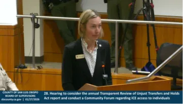 Woman at podium testifying to the SLO County Board of Supervisors