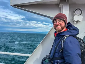 photo of Ryan Goodman on a boat