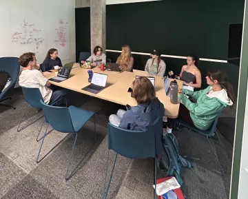 Santa Lucia Student Committee meeting around a conference table