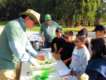 Cheranich teaching students about sea level rise