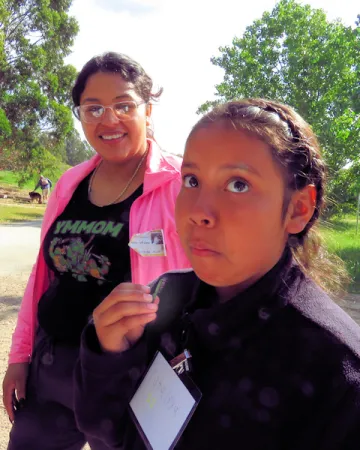 young student tries pickleweed