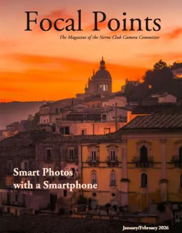 Rosey pre-dawn light bathes the Sicilian villas of Regusa with their tile roofs and a tall dome in the rear perched high above the Mediterranian. 