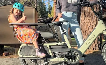 little girl on back of an ebike
