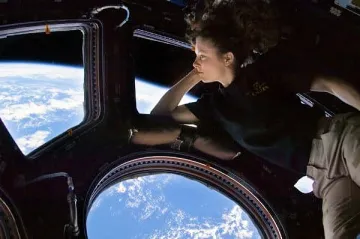 Astronaut looking out of spaceship