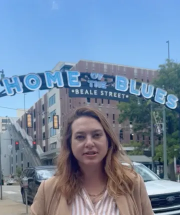 Amy Kelly delivering comments on Beale Street