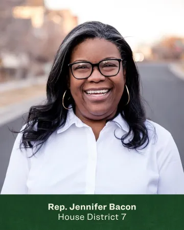 Headshot of Jennifer Bacon with an empty street behind her 