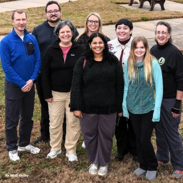 The NC Chapter staff pose for a group photo on a grassy lawn
