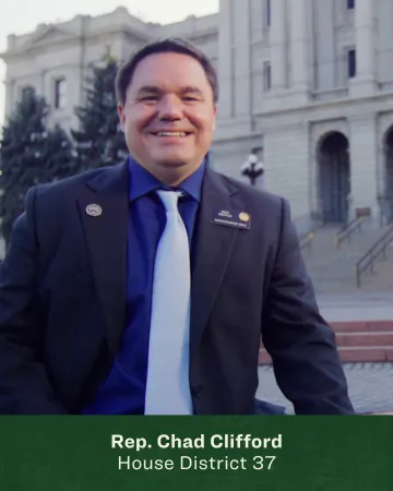 Headshot of Chad Clifford in front of the Colorado State House 