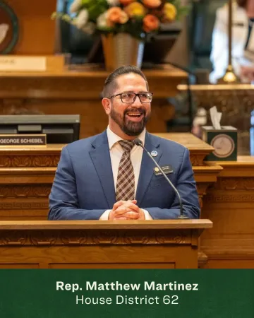 Headshot of Matthew Martinez in the Colorado State House chamber 