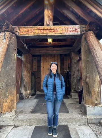 Joyce standing in front of Clair Tappaan Lodge