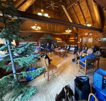Reno ICO retreat members inside clair tappaan lodge