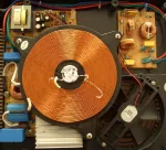 An induction cooking electromagnet https://commons.org/wiki/File:Induktionskochfeld_Spule.jpg