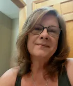 Carla Cope smiles for a selfie.