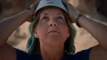 woman looking up with white helmet