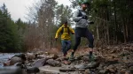 2 people running on forest trail