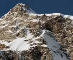 Snowcapped mountain deep blue sky