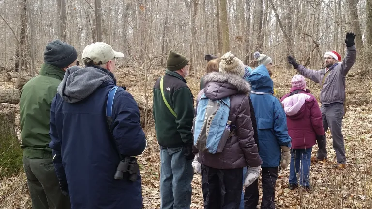 HIkers follow leader in Santa hat