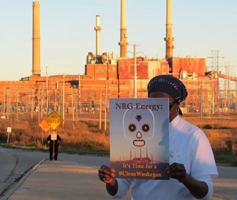 Activist rallies for coal plant cleanup in Waukegan.