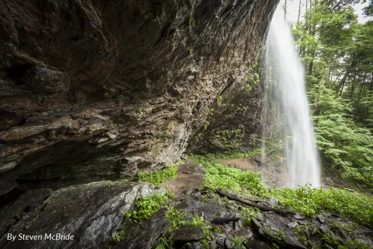 Douglas Falls in the Great Craggy Mountains shown from under the falls' rock formation. Picture by Steven McBride.