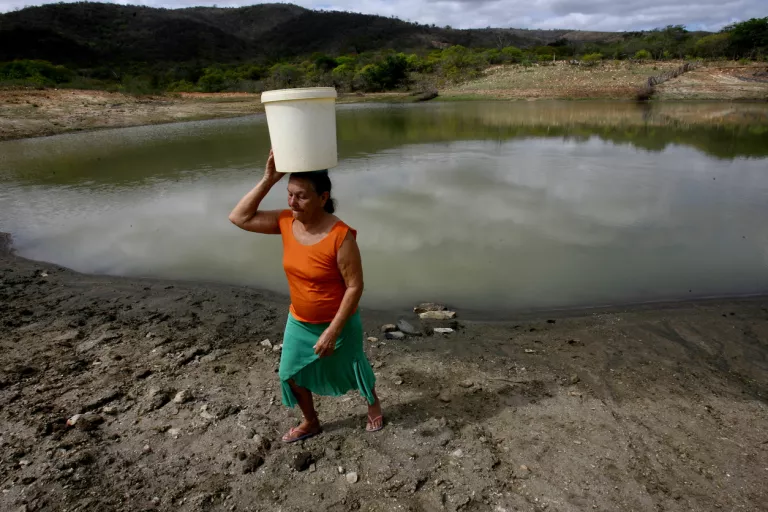 woman carrying water