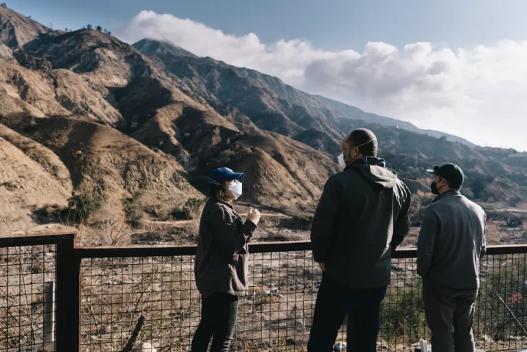 Jenny Binstock, Ben Jealous, and Morgan Goodwin at the burned Eaton Canyon. Photo by Bo Hakala