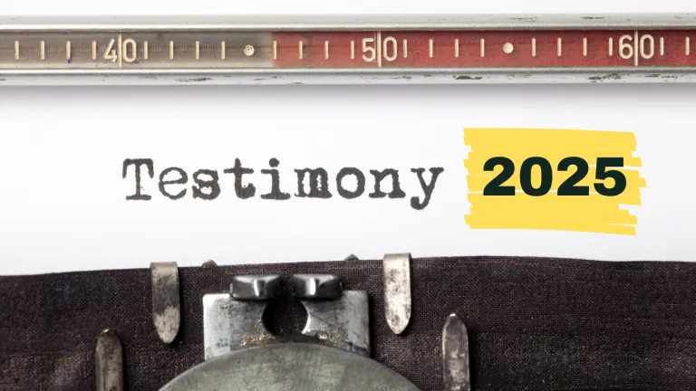 Typewriter typing out "Testimony 2025" 