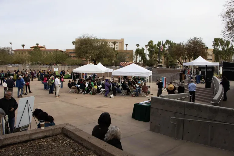 a large event with tents and crowds of people
