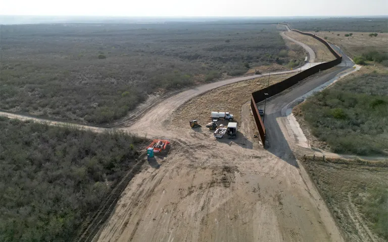 An aerial photo of a gap in the border wall