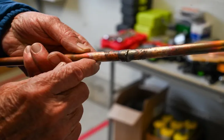 KVCC instructor Dave Whittemore holds copper tubing used in heat pump installations. Photo by Kristian Moravec.