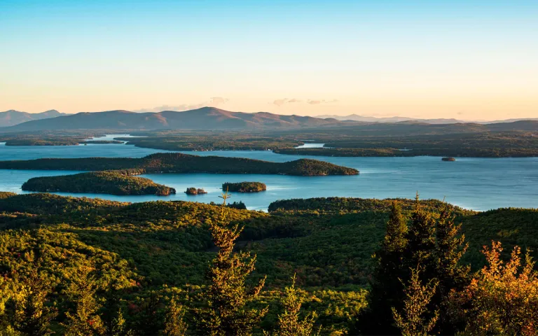 Lake Winnipesaukee from the summit of Mount Major at sunrise.