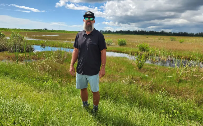 Jimmy Wheeler shows an area near Everglades City still dominated by grasslands. He worries that mangroves will migrate here, too.