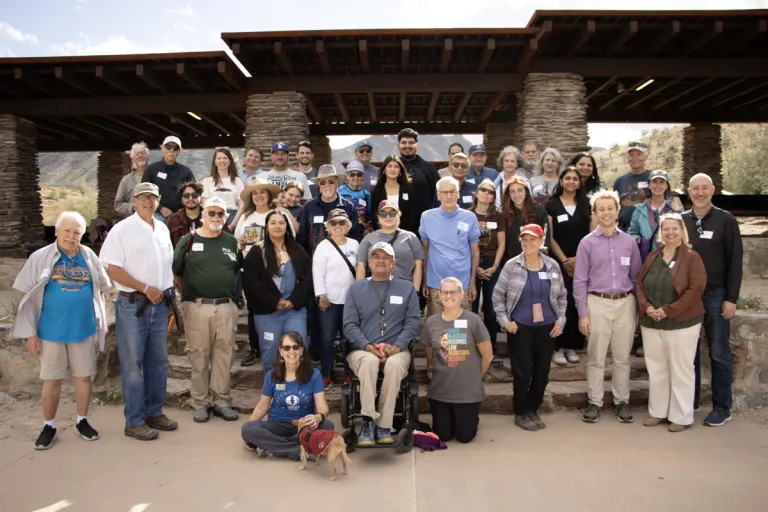 a group photo under a ramada