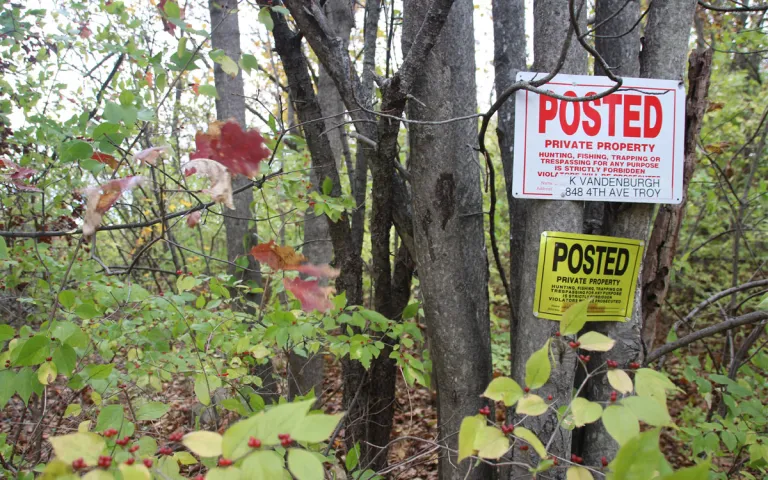 Posted: Private Property" sign at the edge of the 1011 2nd Ave Forest property line