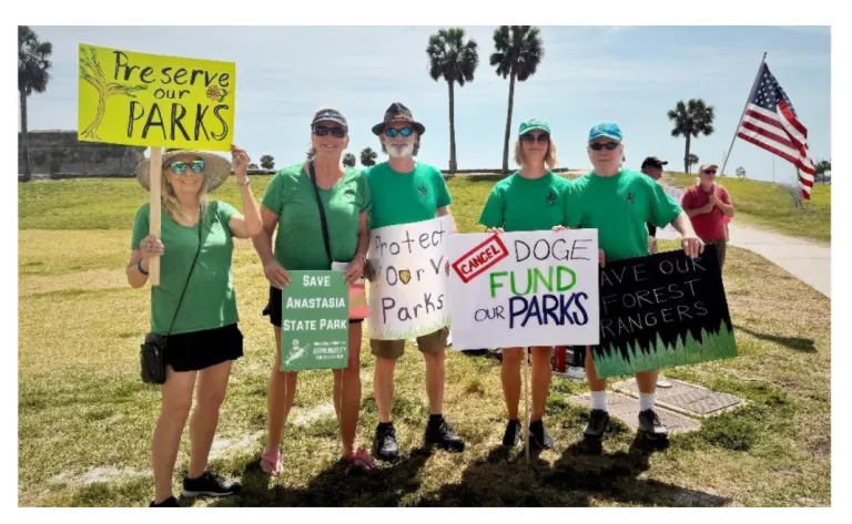 Group photo of 5 SC members at a park love fest