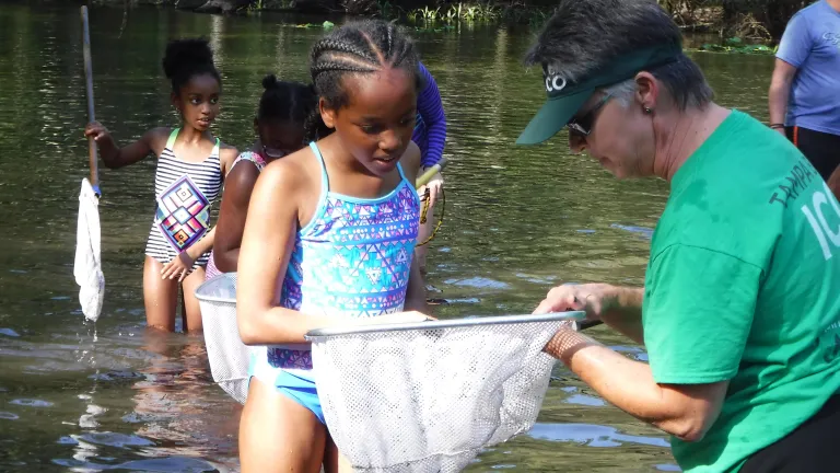 ICO kids using dip nets