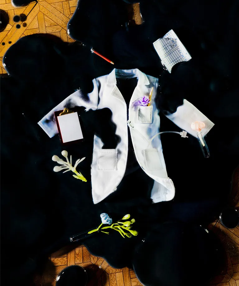 A lab coat covered in oil.