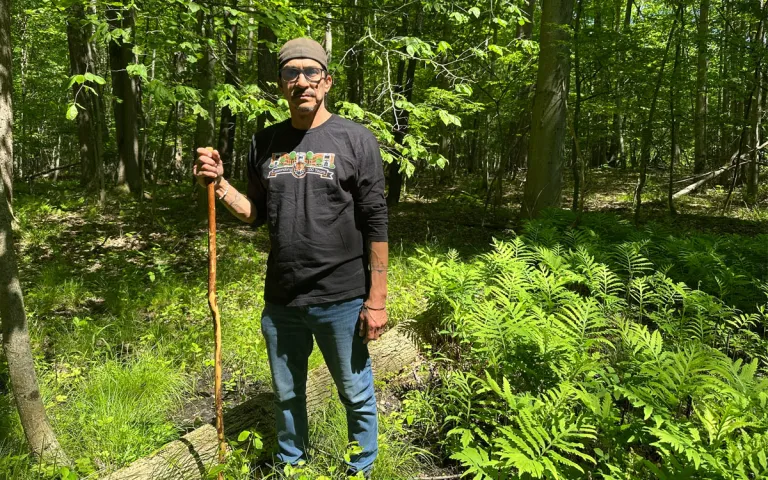 Scott Logan, a member of the Tonawanda Seneca Nation, stands in the Big Woods. 