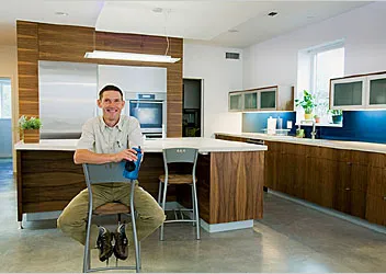 Architect Dave Brach with his concrete countertops and floors, which add to the Breezeway House's energy-storing thermal mass