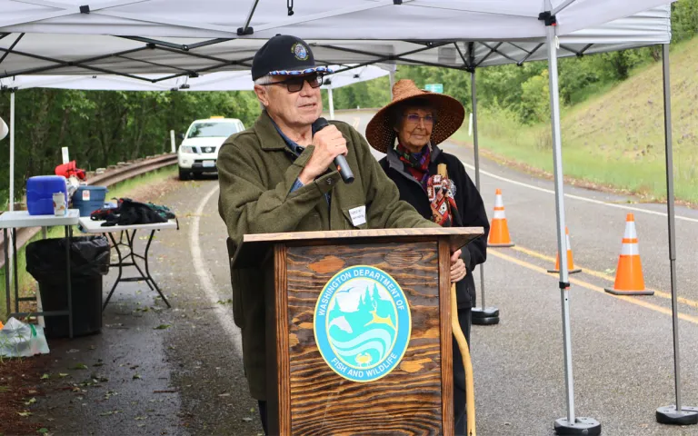 Cowlitz Indian Tribe Chairman William (Bill) Iyall, along with spiritual leader Tanna Engdahl, delivers opening remarks during an event celebrating the reintroduction of Chinook salmon to the upper North Fork Toutle River watershed within the Mount St. Helens National Volcanic Monument on June 10, 2026.