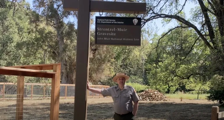 John Muir National Historic Site Superintendent Tom Leatherman shows new signage and fencing at the gravesite, 2021.
