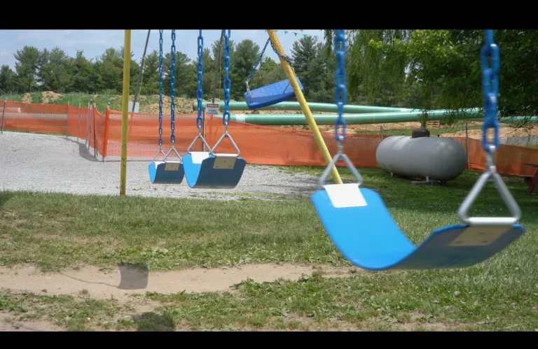 playground with pipeline in background