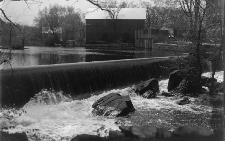 The Talbot Mills Dam in Billerica, Massachusetts—shown in this 1908 photograph—has vexed environmentalists, agrarians, and native fish for centuries. Photograph public domain via Billerica Public Library